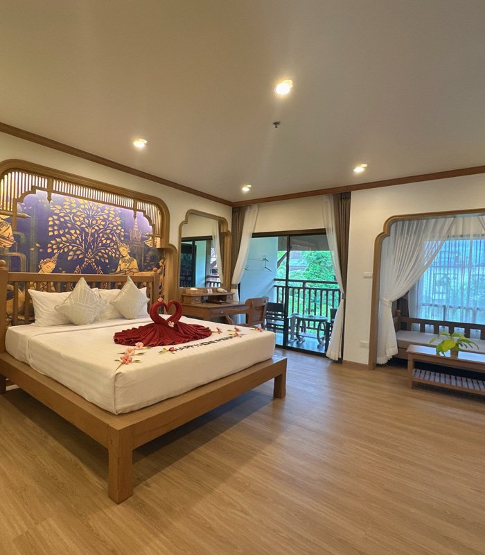 Grand Deluxe suite in natural wood with balcony